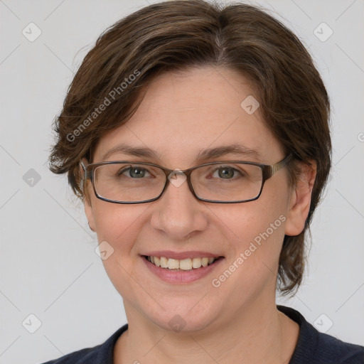 Joyful white adult female with medium  brown hair and grey eyes