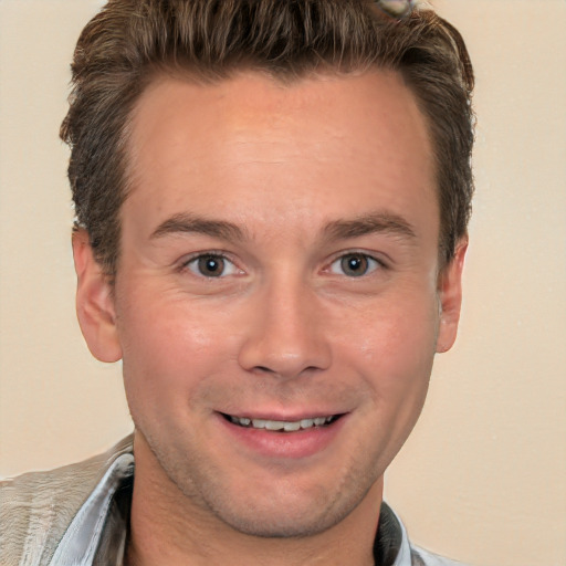 Joyful white adult male with short  brown hair and brown eyes