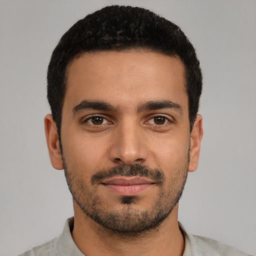 Neutral latino young-adult male with short  black hair and brown eyes