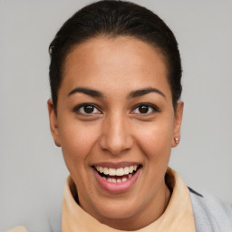 Joyful latino young-adult female with short  brown hair and brown eyes