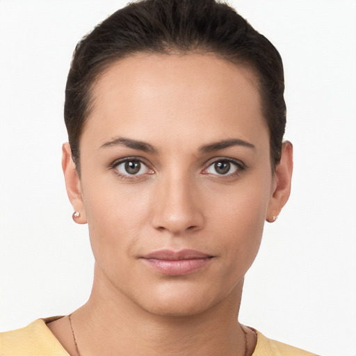 Joyful white young-adult female with short  brown hair and brown eyes