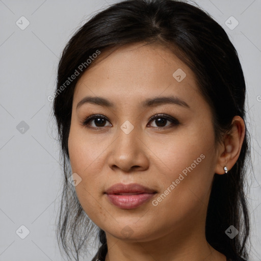 Joyful asian young-adult female with long  brown hair and brown eyes