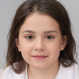 Joyful white child female with medium  brown hair and brown eyes