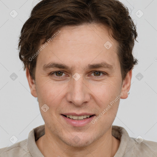 Joyful white adult male with short  brown hair and grey eyes