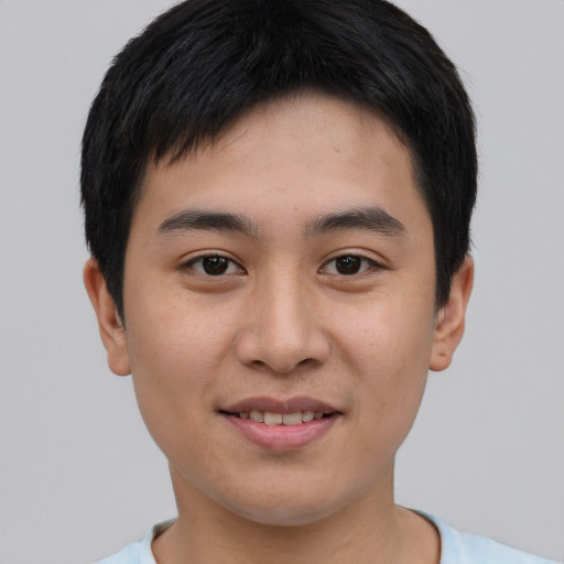 Joyful asian young-adult male with short  brown hair and brown eyes