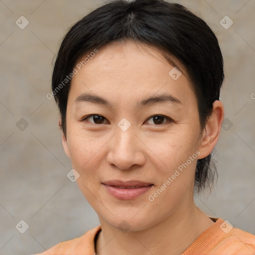 Joyful asian young-adult female with medium  brown hair and brown eyes