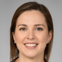 Joyful white young-adult female with medium  brown hair and brown eyes