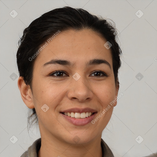 Joyful latino young-adult female with short  brown hair and brown eyes