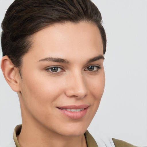 Joyful white young-adult female with short  brown hair and brown eyes