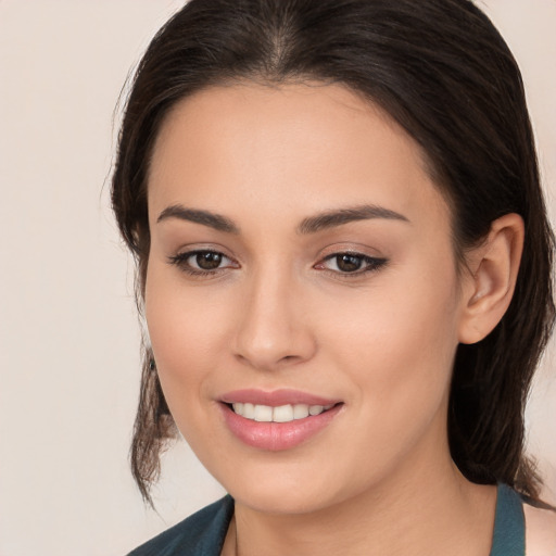 Joyful white young-adult female with medium  brown hair and brown eyes