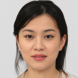 Joyful asian young-adult female with medium  brown hair and brown eyes