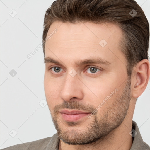 Joyful white young-adult male with short  brown hair and brown eyes