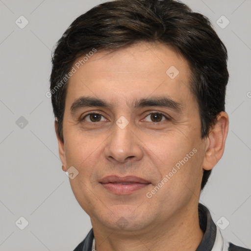 Joyful white adult male with short  brown hair and brown eyes