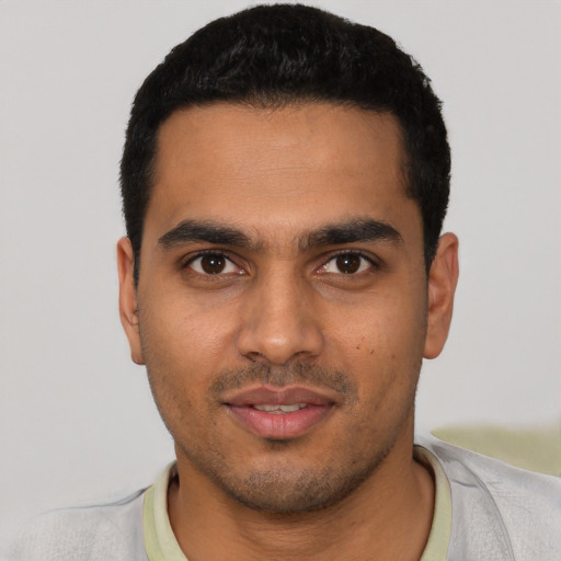 Neutral latino young-adult male with short  black hair and brown eyes