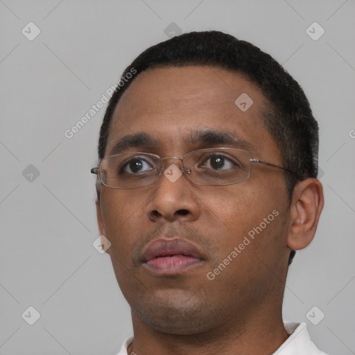 Neutral black young-adult male with short  black hair and brown eyes