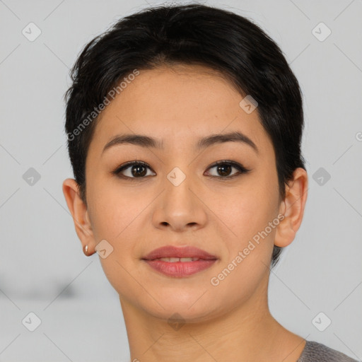 Joyful asian young-adult female with short  black hair and brown eyes