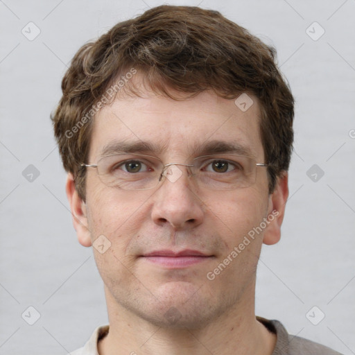 Joyful white adult male with short  brown hair and grey eyes