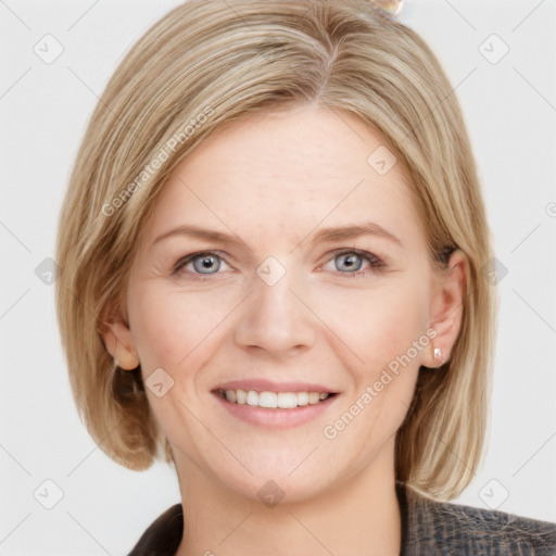 Joyful white young-adult female with medium  brown hair and blue eyes