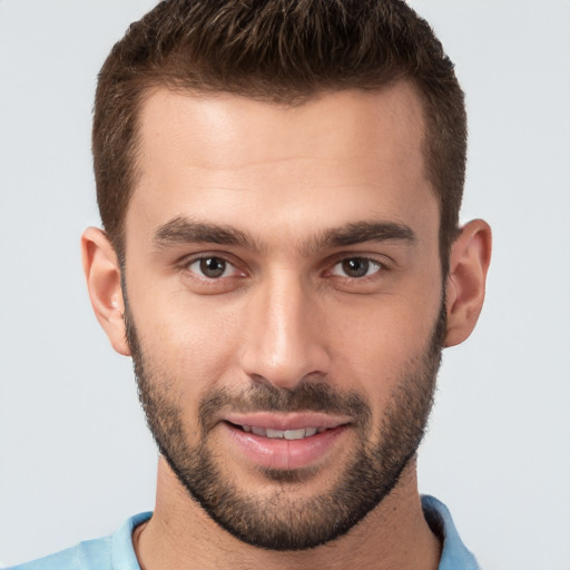 Joyful white young-adult male with short  brown hair and brown eyes