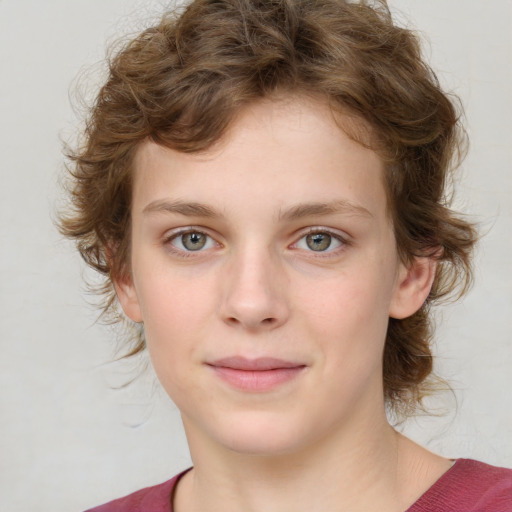 Joyful white child female with medium  brown hair and grey eyes