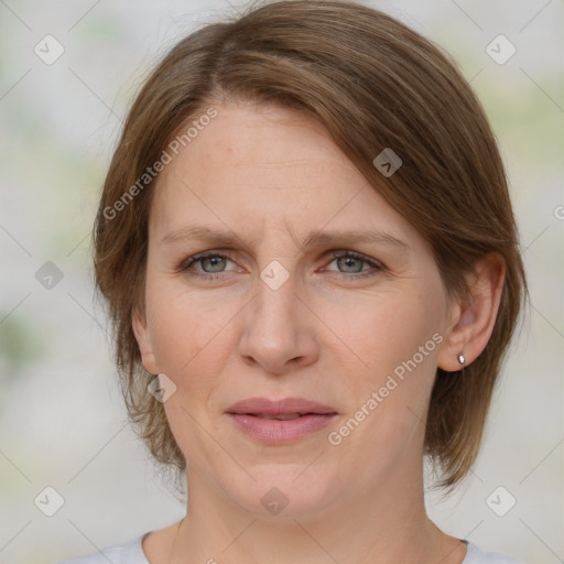 Joyful white adult female with medium  brown hair and grey eyes