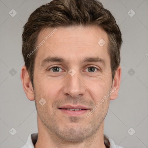 Joyful white adult male with short  brown hair and grey eyes