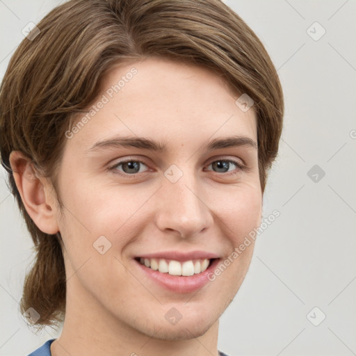 Joyful white young-adult female with short  brown hair and grey eyes