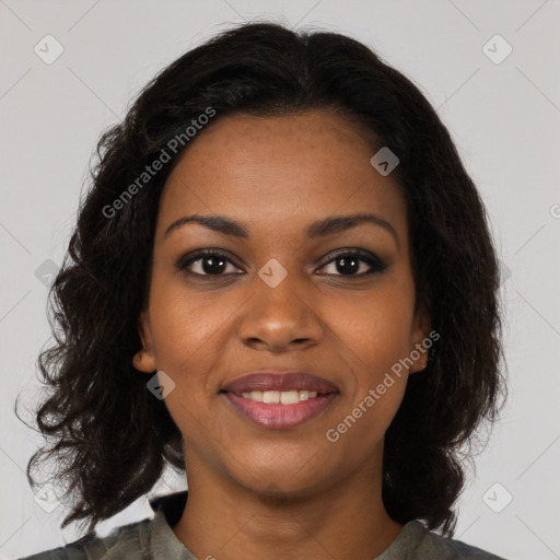 Joyful black young-adult female with medium  brown hair and brown eyes