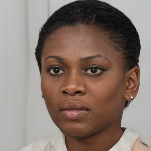 Neutral black young-adult female with short  black hair and brown eyes