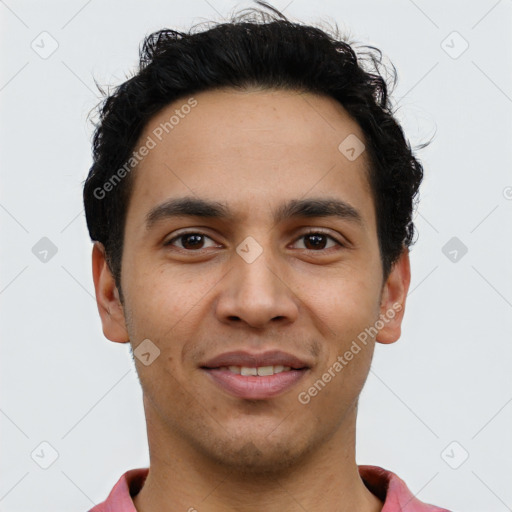 Joyful latino young-adult male with short  brown hair and brown eyes