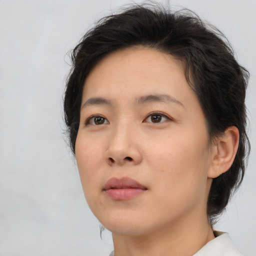 Neutral asian young-adult female with medium  brown hair and brown eyes