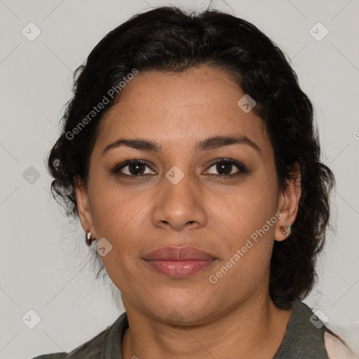 Joyful latino adult female with medium  brown hair and brown eyes