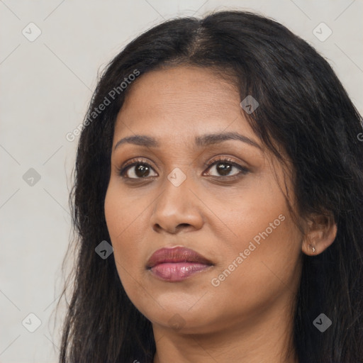 Joyful latino young-adult female with long  black hair and brown eyes