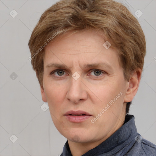 Joyful white adult female with short  brown hair and grey eyes