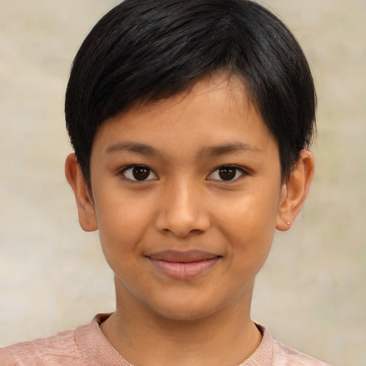 Joyful latino child female with short  brown hair and brown eyes