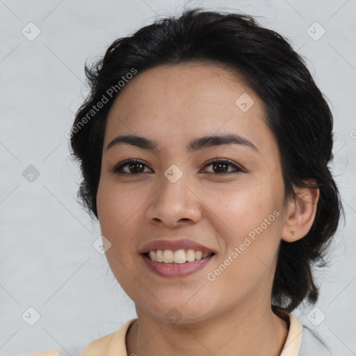 Joyful latino young-adult female with medium  brown hair and brown eyes