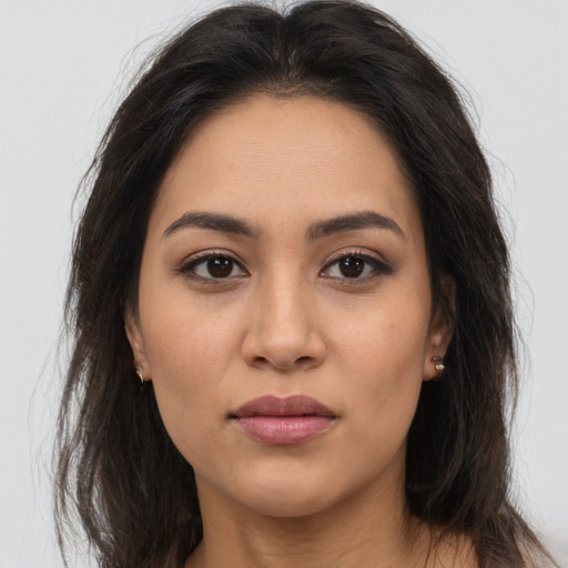 Joyful white young-adult female with long  brown hair and brown eyes