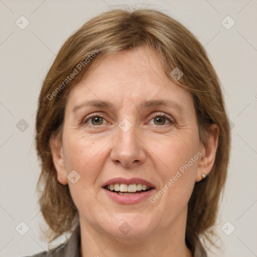 Joyful white adult female with medium  brown hair and grey eyes