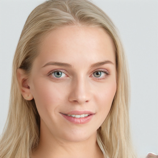 Joyful white young-adult female with long  brown hair and blue eyes