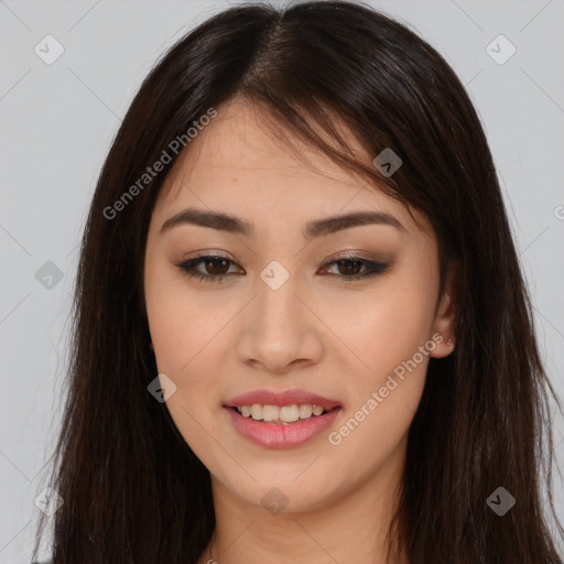 Joyful asian young-adult female with long  brown hair and brown eyes