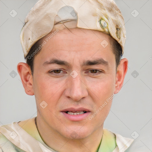 Joyful white adult male with short  brown hair and grey eyes