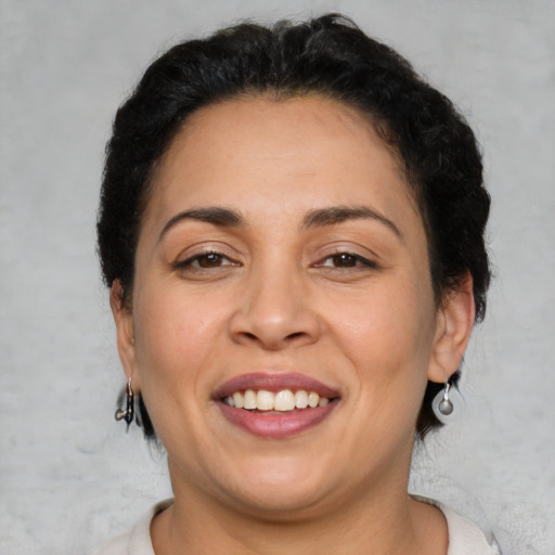 Joyful asian adult female with medium  brown hair and brown eyes
