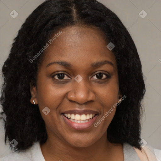 Joyful black young-adult female with medium  black hair and brown eyes