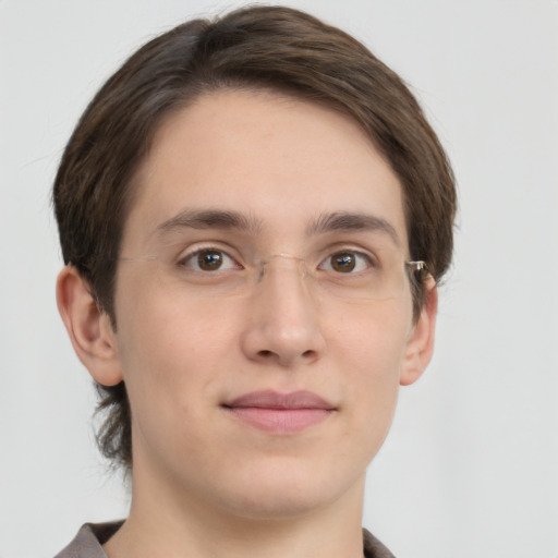 Joyful white young-adult male with medium  brown hair and grey eyes