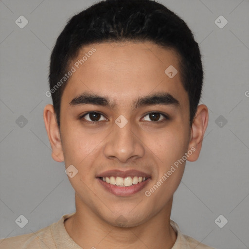 Joyful latino young-adult male with short  brown hair and brown eyes