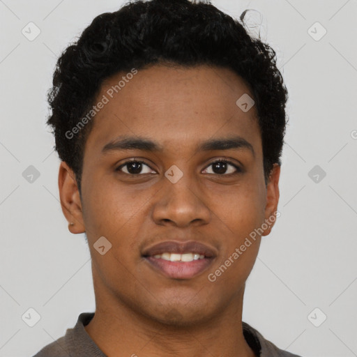 Joyful black young-adult male with short  brown hair and brown eyes