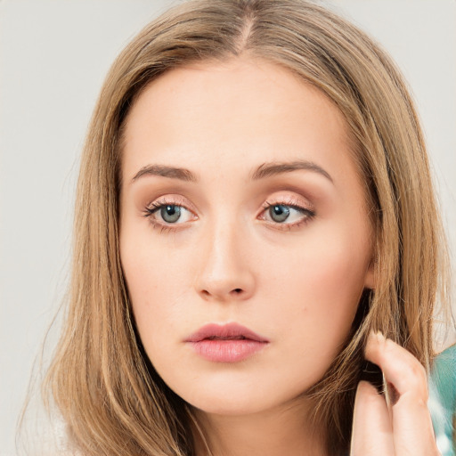 Neutral white young-adult female with long  brown hair and brown eyes