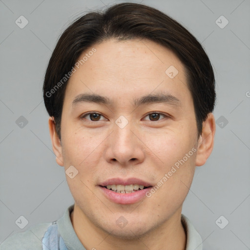 Joyful asian young-adult male with short  brown hair and brown eyes