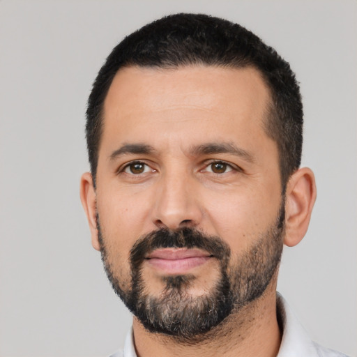 Neutral latino adult male with short  black hair and brown eyes