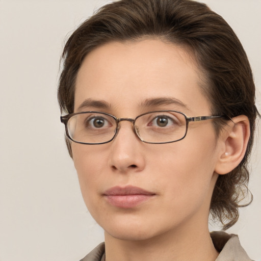 Neutral white young-adult female with medium  brown hair and grey eyes